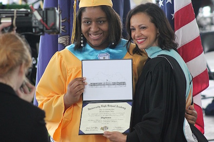 Picture of a student with diploma.
